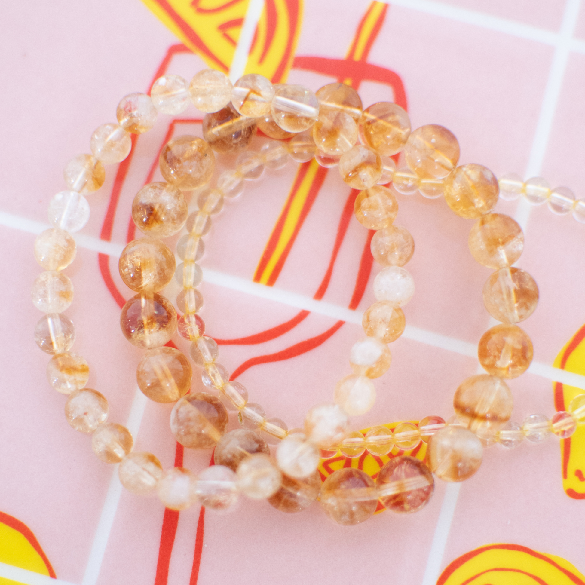Beaded bracelets on a colorful background